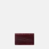 Medusa 95 Clutch mit Krokodilleder-Optik